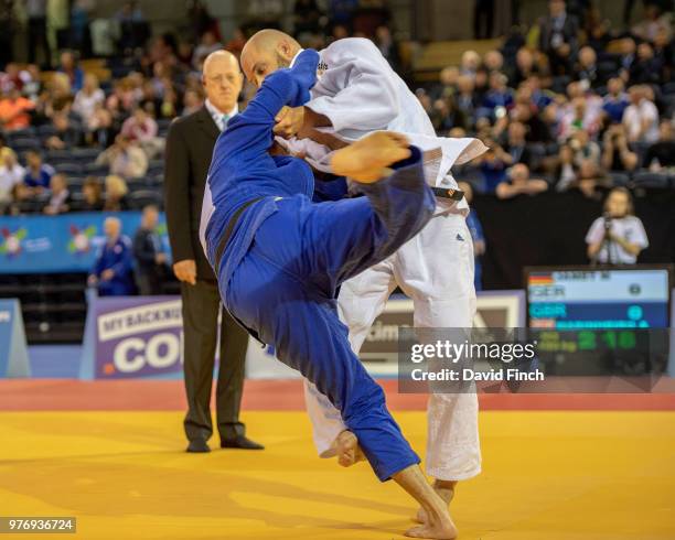 Marcel Jamet of Germany throws Anselmo Marinheiro of Great Britain for a wazari with a foot sweep. Later, he threw Marinheiro for an ippon to win...