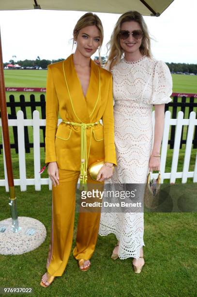 Martha Hunt and Candice Lake attend the Cartier Queen's Cup Polo Final at Guards Polo Club on June 17, 2018 in Egham, England.