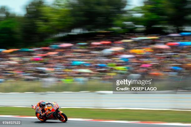 Repsol Honda Team's Spanish rider Marc Marquez rides during the Catalunya MotoGP Grand Prix race at the Catalunya racetrack in Montmelo, near...