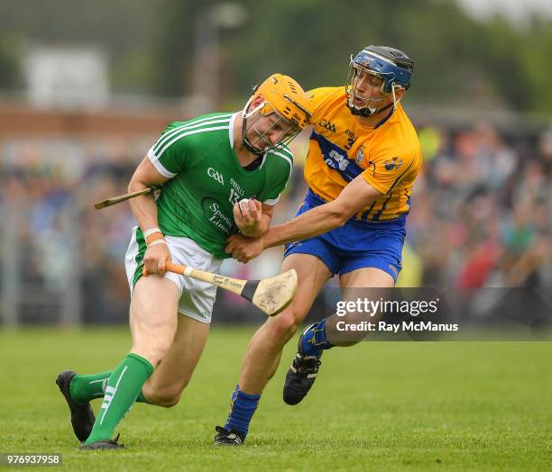 Ennis , Ireland - 17 June 2018; Seamus Flanagan of Limerick in action against David McInerney of Clare during the Munster GAA Hurling Senior...