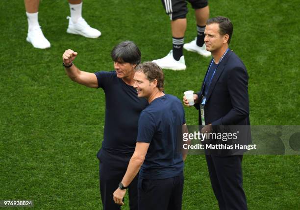 Marcus Sorg, Germany assistant manager, Joachim Loew, Manager of Germany, and Oliver Bierhoff, Team Co-ordinator speak together during the pitch...