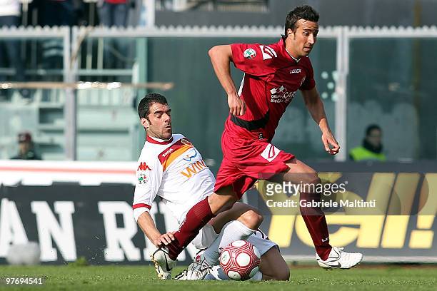 Davide Di Gennaro of AS Livorno Calcio battles for the ball with Simone Perrotta of AS Roma during the Serie A match between AS Livorno Calcio and AS...