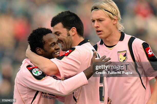 Fabio Simplicio of Palermo celebrates the equalizing goal with team-mates Cesare Bovo and Simon Kjaer during the Serie A match between Udinese Calcio...