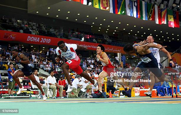 Dayron Robles of Cuba crosses the line to win the gold medal in the Mens 60m Hurdles Final during Day 3 of the IAAF World Indoor Championships at the...