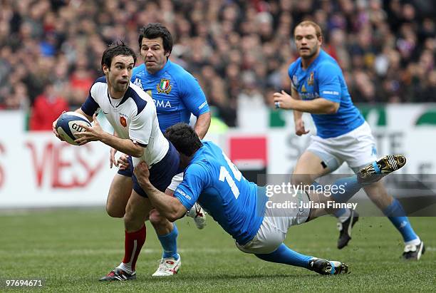 Morgan Parra of France is tackled by Andrea Masi of Italy during the RBS Six Nations match between France and Italy at Stade de France on March 14,...