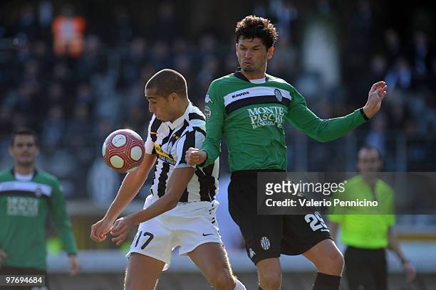 David Trezeguet of Juventus FC clashes with Emilson Sanchez Cribari of AC Siena during the Serie A match between Juventus FC and AC Siena at Stadio...