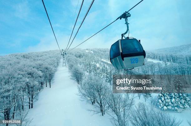 overhead cable car in winter, akita, tohoku, japan - ski resort stock pictures, royalty-free photos & images