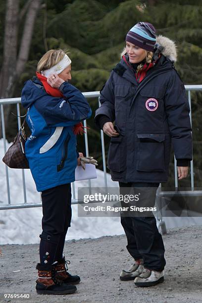 Queen Sonja Of Norway and Crown Princess Of Norway Mette-Marit leave the Ski Jumping hill in Holmenkollen on March 14, 2010 in Oslo, Norway.