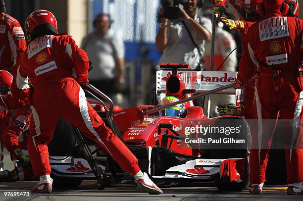 Felipe Massa of Brazil and Ferrari comes in for a pitstop during the Bahrain Formula One Grand Prix at the Bahrain International Circuit on March 14,...