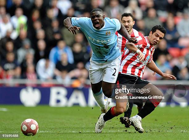 Micah Richards of Manchester City is challenged by Kieran Richardson of Sunderland during the Barclays Premier League match between Sunderland and...