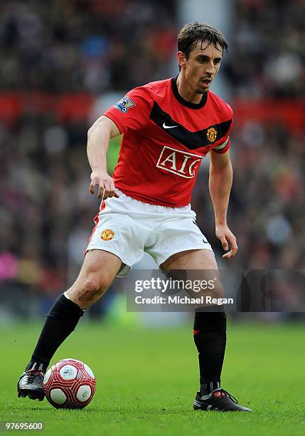 Gary Neville of Manchester United on the ball during the Barclays Premier League match between Manchester United and Fulham at Old Trafford on March...