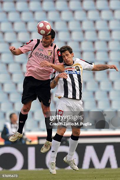Cesare Bovo of Palermo and Floro Flores of Udinese compete for a header during the Serie A match between Udinese Calcio and US Citta di Palermo at...