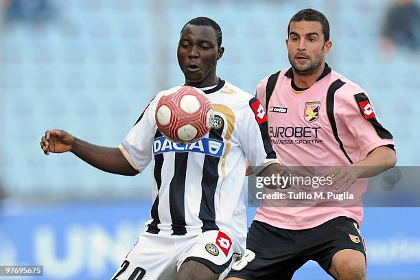 Kwadwo Asamoah of Udinese and Manuele Blasi of Palermo compete for the ball during the Serie A match between Udinese Calcio and US Citta di Palermo...