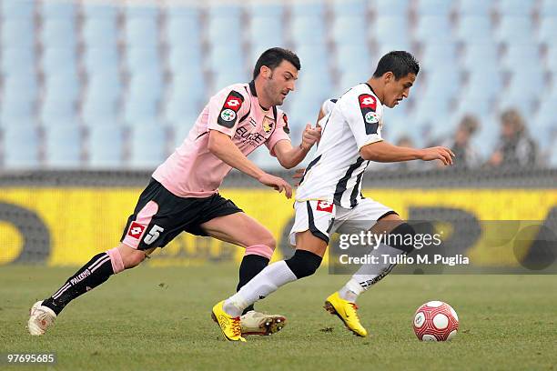 Cesare Bovo of Palermo and Alexis Sanchez of Udinese compete for the ball during the Serie A match between Udinese Calcio and US Citta di Palermo at...