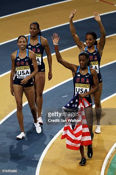 Debbie Dunn, Deedee Trotter, Natasha Hastings and Allyson Felix of USA celebrate victory in the Womens 4 x 400m relay during Day 3 of the IAAF World...