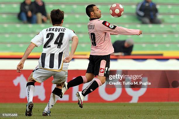 Fabrizio Miccoli of Palermo and Aleksandar Lukovic of Udinese compete for the ball during the Serie A match between Udinese Calcio and US Citta di...