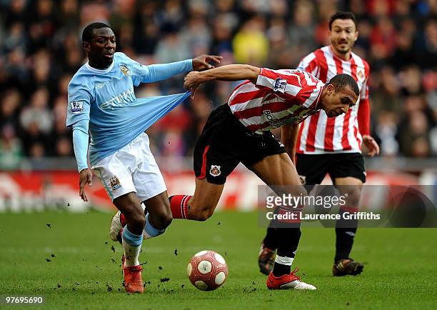 Anton Ferdinand of Sunderland tangles with Shaun Wright- Phillips of Manchester City during the Barclays Premier League match between Sunderland and...