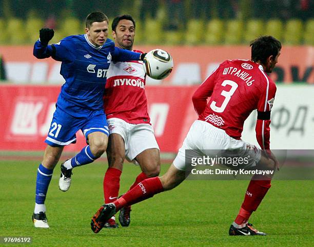 Ibson and Martin Stranzl of FC Spartak Moscow battles for the ball with Igor Semshov of FC Dynamo Moscow during the Russian Football League...