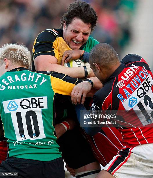 Phil Dawson of Northampton Saints is tackled during the LV Anglo Welsh Cup Semi Final match between Northampton Saints and Saracens at Franklin's...