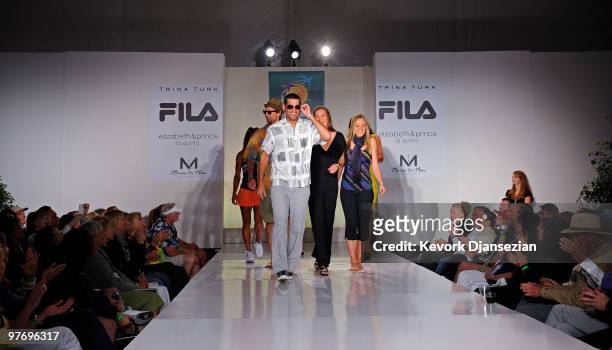 Andy Ram leads fellow tennis players down the runway after they participated in a fashion show during the BNP Paribas Open on March 13, 2010 in...