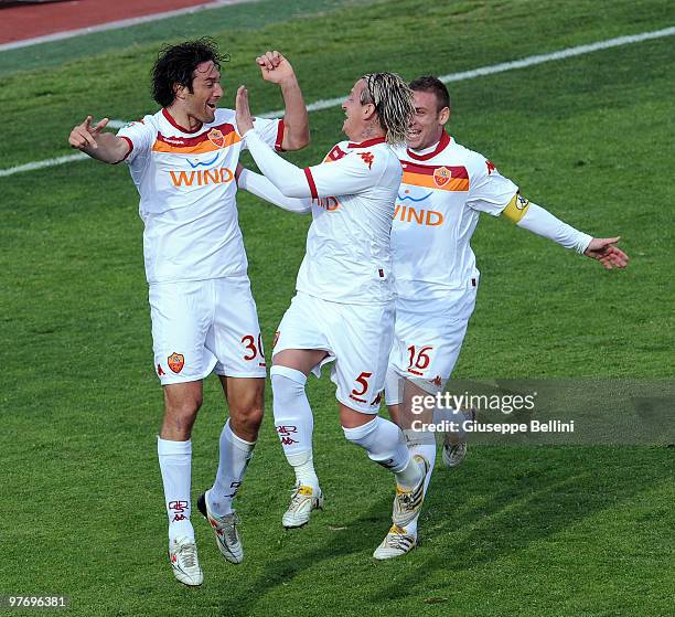 Luca Toni and Philippe Mexes and Daniele De Rossi of Roma celebrate the goal during the Serie A match between AS Livorno Calcio and AS Roma at Stadio...