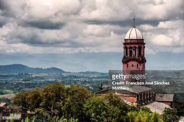 clouds over church in ulloa, valle del cauca, colombia - francisco villa fotografías e imágenes de stock