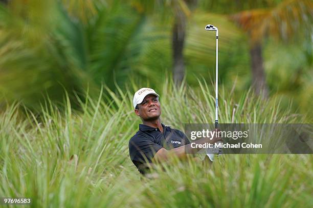 Julio Santos of the Dominican Republic hits from deep rough during the continuation of the second round of the Puerto Rico Open presented by Banco...