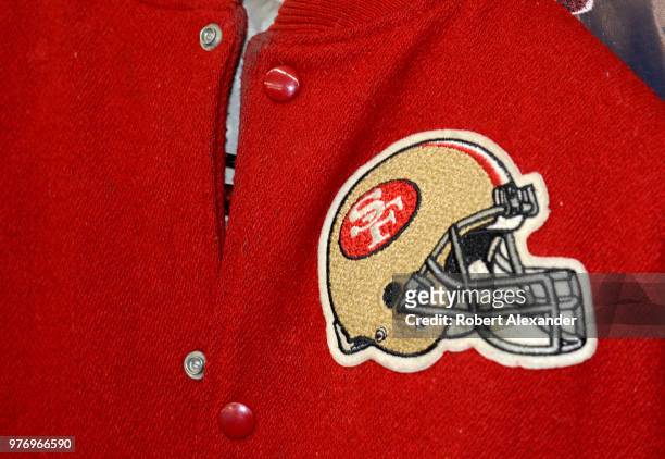 Football fan's vintage 1980s San Francisco 49ers jacket for sale in an antique shop.
