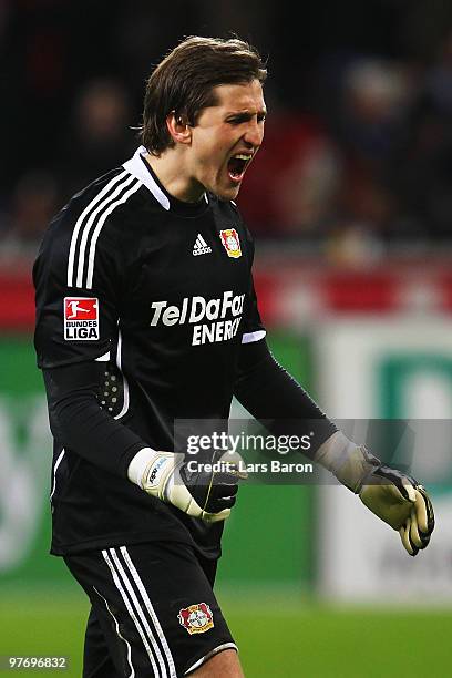 Goalkeeper Rene Adler of Leverkusen celebrates after team mate Stefan Kiessling scored his second goal during the Bundesliga match between Bayer...