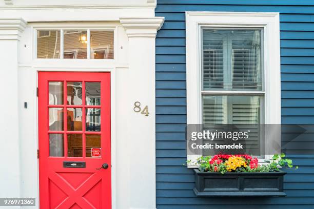 front door and window in historic charlestown boston massachusetts usa - blue house red door stock pictures, royalty-free photos & images