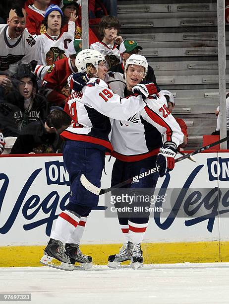 Alexander Semin of the Washington Capitals hugs teammate Nicklas Backstrom after Backstrom scored their second goal against the Chicago Blackhawks on...