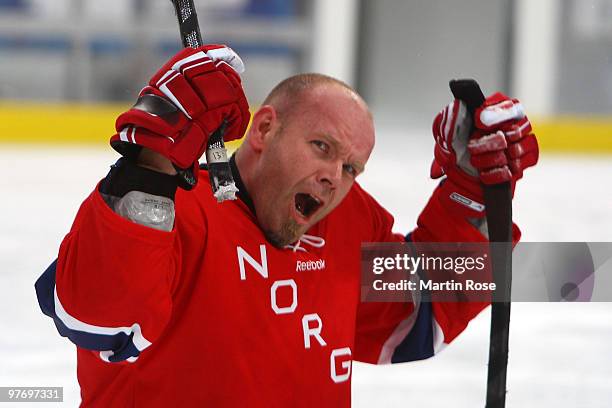 Kjell Vidar Royne of Norway celebrates their 2-1 victory over Italy during the Ice Sledge Hockey Preliminary Round Group B Game between Norway and...