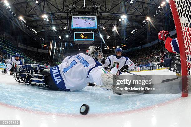 Santino Stillitano of Italy is scored on for the second time by Kjell Vidar Royne of Norway during the third period of the Ice Sledge Hockey...