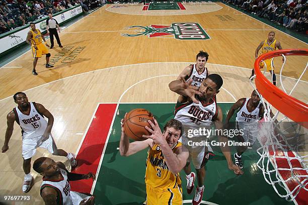 Troy Murphy of the Indiana Pacers shoots a layup against Charlie Bell of the Milwaukee Bucks on March 14, 2010 at the Bradley Center in Milwaukee,...