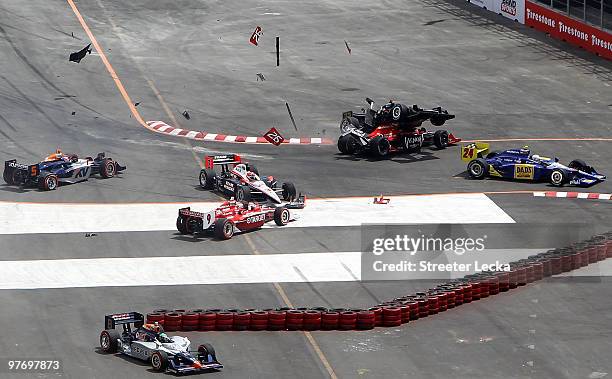 Mario Moraes of Brazil, driver of the KV Racing Technology Dallara Honda, collides with Marco Andretti of the United States, driver of the Team Venom...