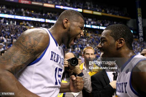 DeMarcus Cousins and John Wall of the Kentucky Wildcats celebrate after they won 75-74 in overtime against the Mississippi State Bulldogs during the...