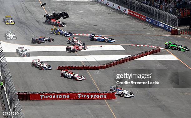 Mario Moraes of Brazil, driver of the KV Racing Technology Dallara Honda, collides with Marco Andretti of the United States, driver of the Team Venom...