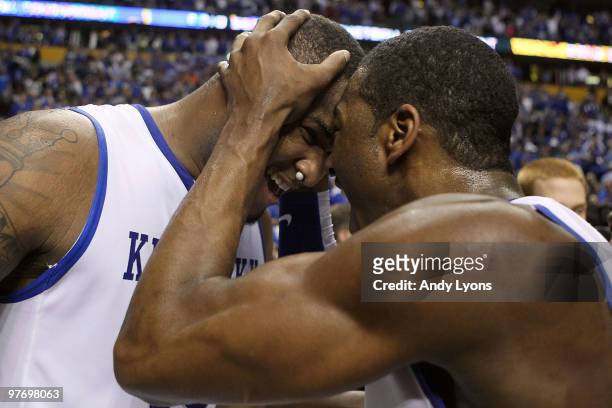 DeMarcus Cousins and John Wall of the Kentucky Wildcats celebrate after they won 75-74 in overtime against the Mississippi State Bulldogs during the...