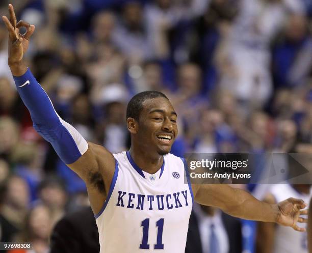 John Wall of the Kentucky Wildcats reacts after he made a basket in overtime against the Mississippi State Bulldogs during the final of the SEC Men's...