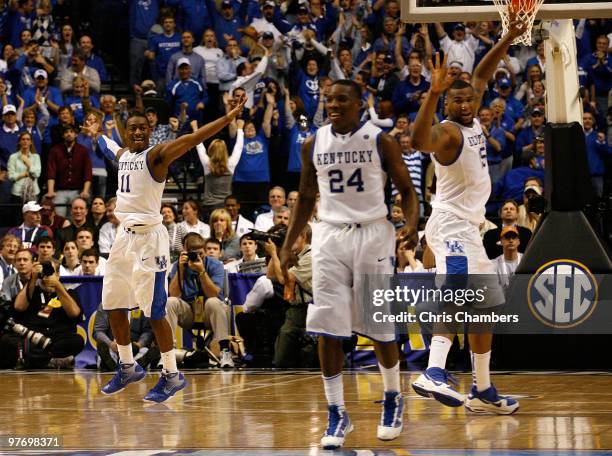John Wall, Eric Bledsoe and DeMarcus Cousins of the Kentucky Wildcats celebrate after John Wall made a 3-point basket with less then :30 seconds to...