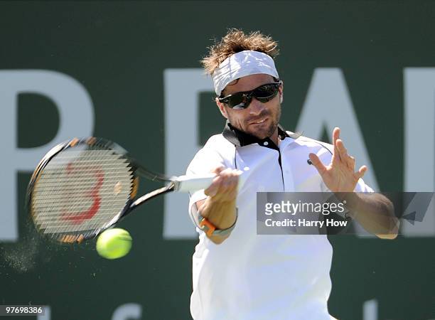 Arnaud Clement of France hits a forehand in his match with Marcos Baghdatis of Cyprus during the BNP Paribas Open at the Indian Wells Tennis Garden...