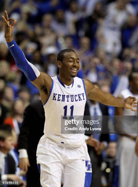 John Wall of the Kentucky Wildcats reacts after he made a 3-point basket with less then :30 seconds to go in overtime against the Mississippi State...