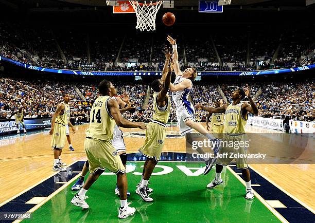 Kyle Singler of the Duke Blue Devils drives to the hoop against Georgia Tech Yellow Jackets in the championship game of the 2010 ACC Men's Basketball...