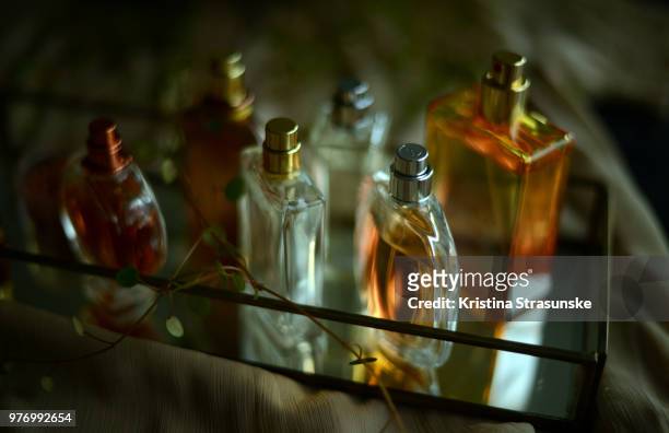 perfume bottles on a tray - kristina strasunske ストックフォトと画像