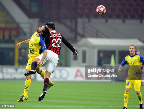 Marco Borriello of AC Milan competes for the ball with Mario Yepes of AC Chievo during the Serie A match between AC Milan and AC Chievo Verona at...