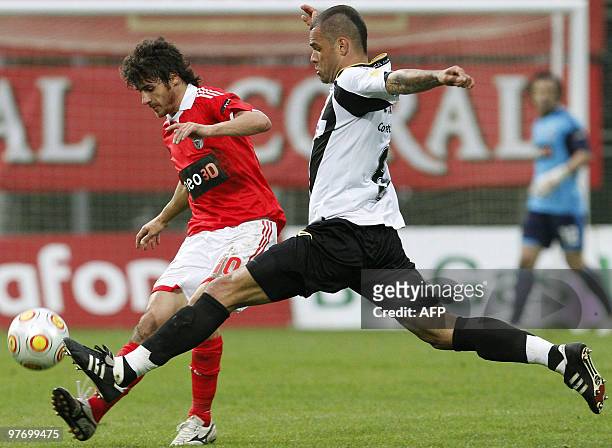 Benfica's Argentinian midfielder Pablo Aimar vies with Nacional's defender Luis Alberto during their Portuguese league football match at Madeira...