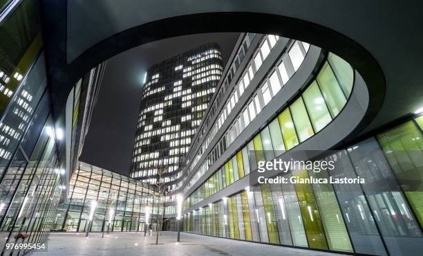 exterior of modern illuminated building, munich, bavaria, germany - munich stock pictures, royalty-free photos & images