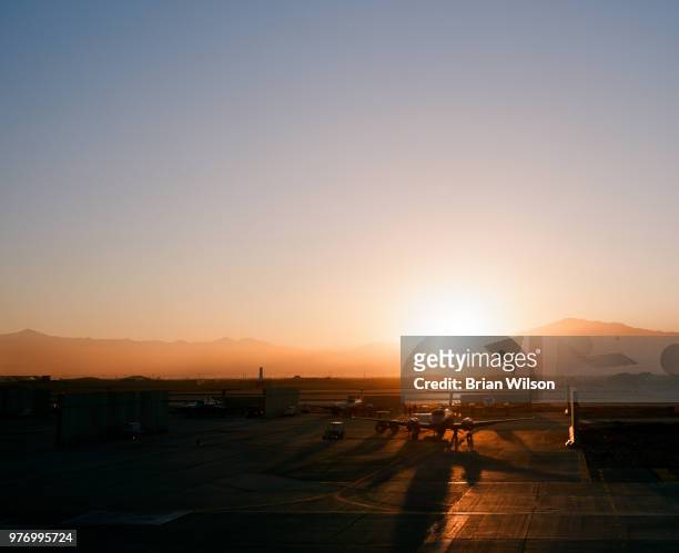 sunset over united states air force airport - tranquility base stock pictures, royalty-free photos & images