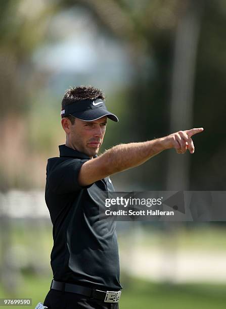 Charl Schwartzel of South Africa gestures on the second hole during the final round of the 2010 WGC-CA Championship at the TPC Blue Monster at Doral...