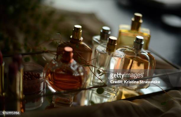 perfume bottles on tray - perfume atomizer stock pictures, royalty-free photos & images